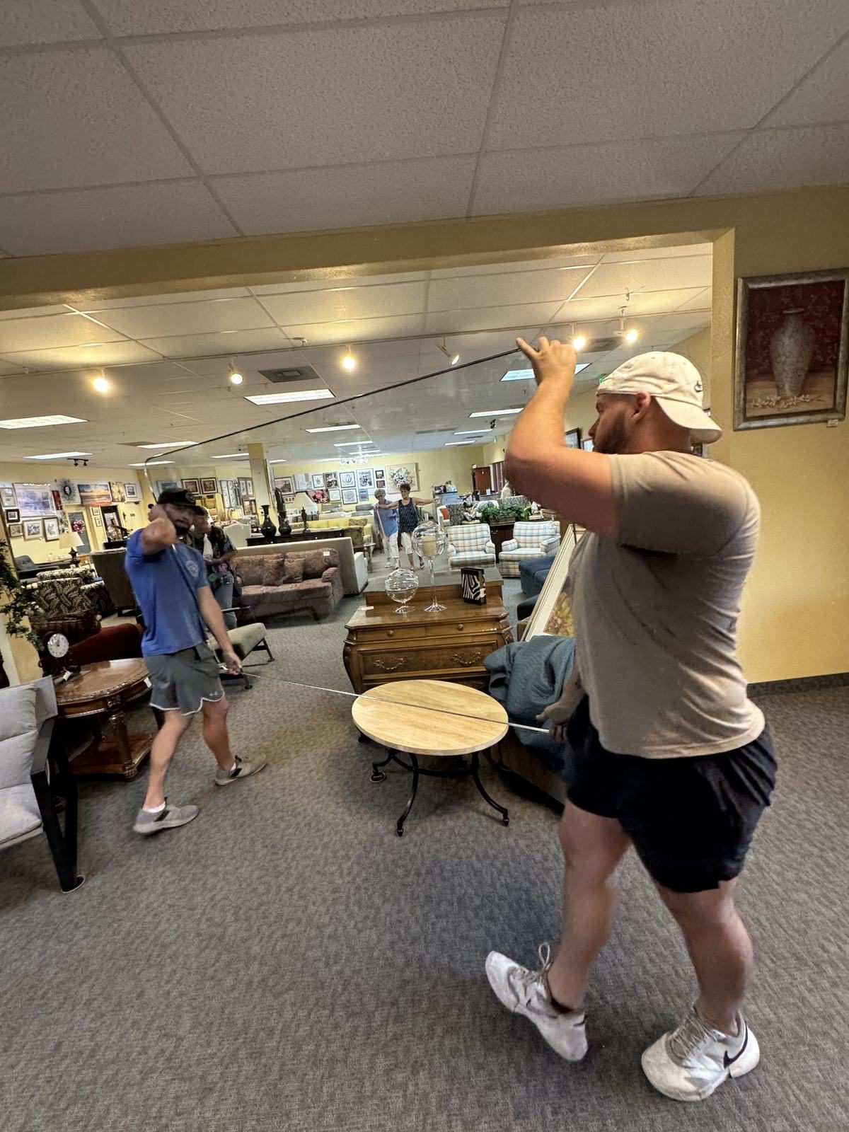 Movers delivering furniture into a retail space