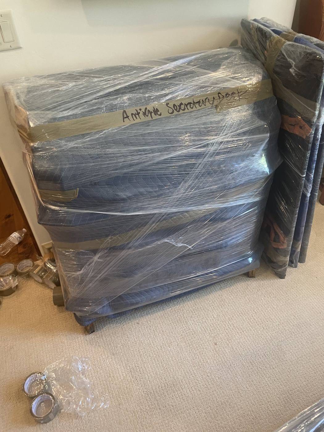 Furniture wrapped and protected, ready to be moved into storage